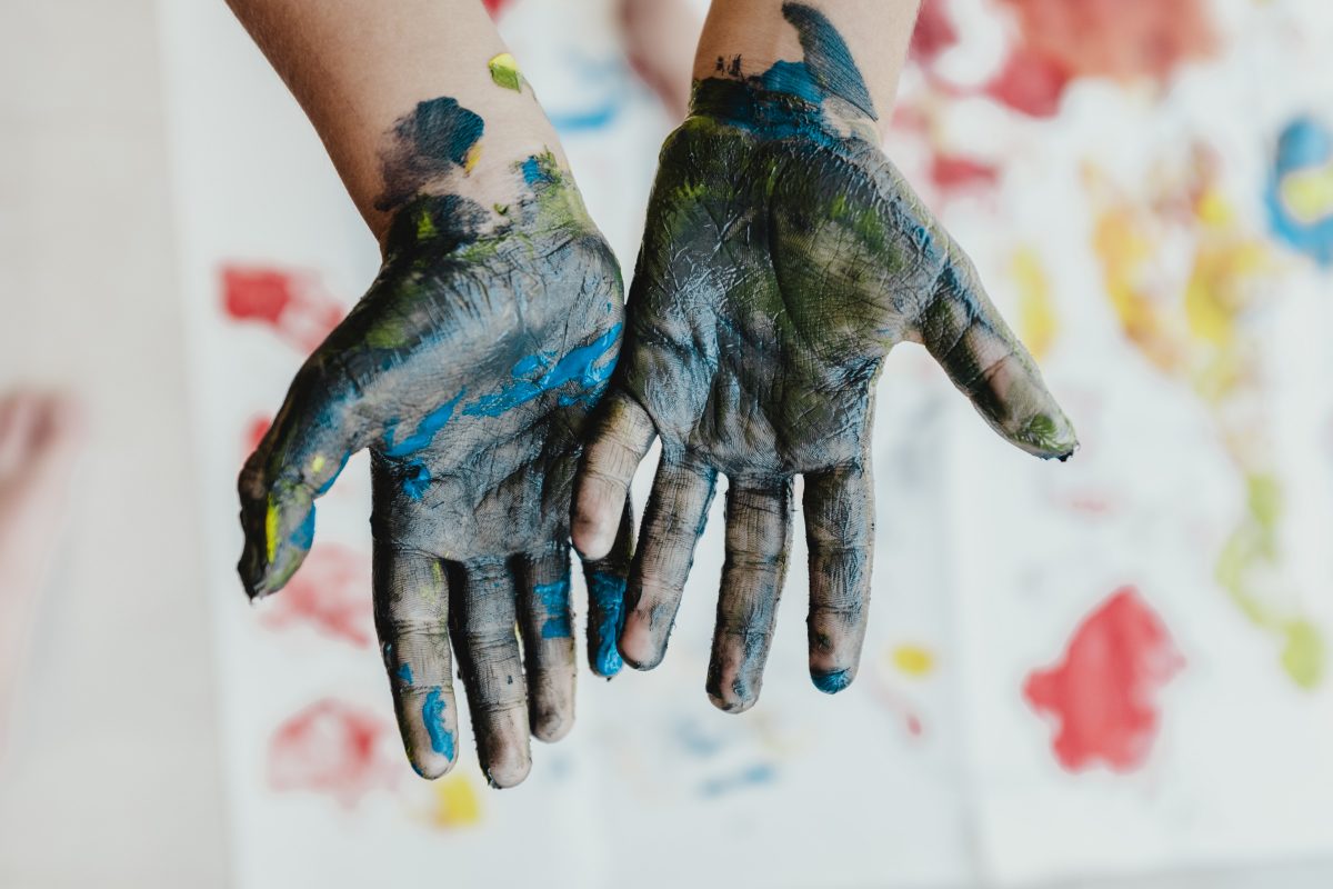 Hands covered with paint