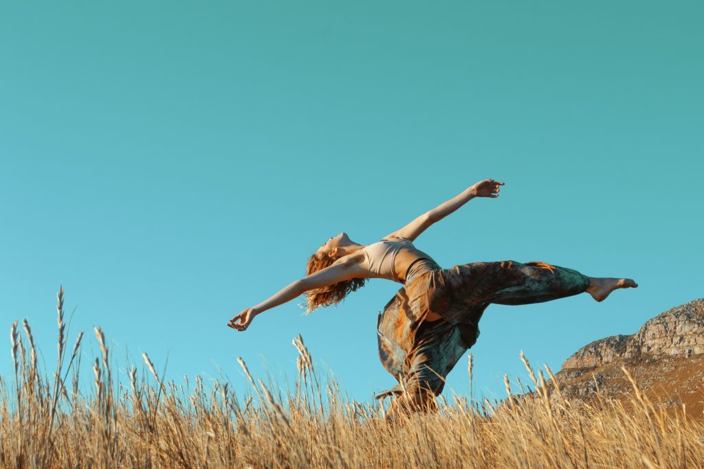 a person dancing across a field