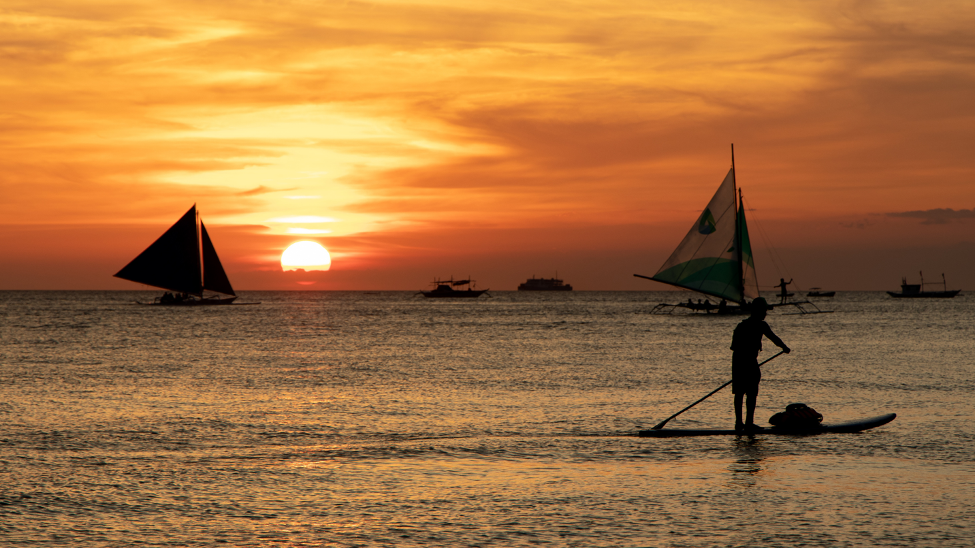 Paraw crossing over Boracay sunset